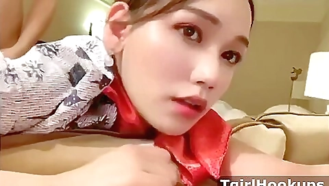 Asian maid sucks a dick on the bed and gets fucked