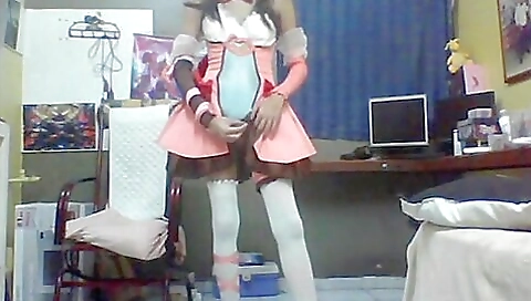 Vintage brunette is in stockings on the bed in lingerie