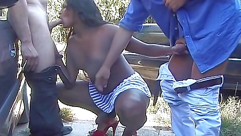 Two trans and ebony sluts sucking a dick on a beach