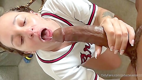 A big cock is inside a brunette with a tattooed pussy