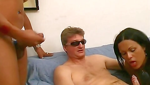 Hairy babe with large boobs fucked in a retro threesome video