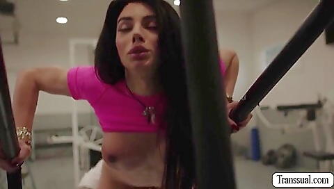 Big tittied brunette is fucking a bald guy in the gym